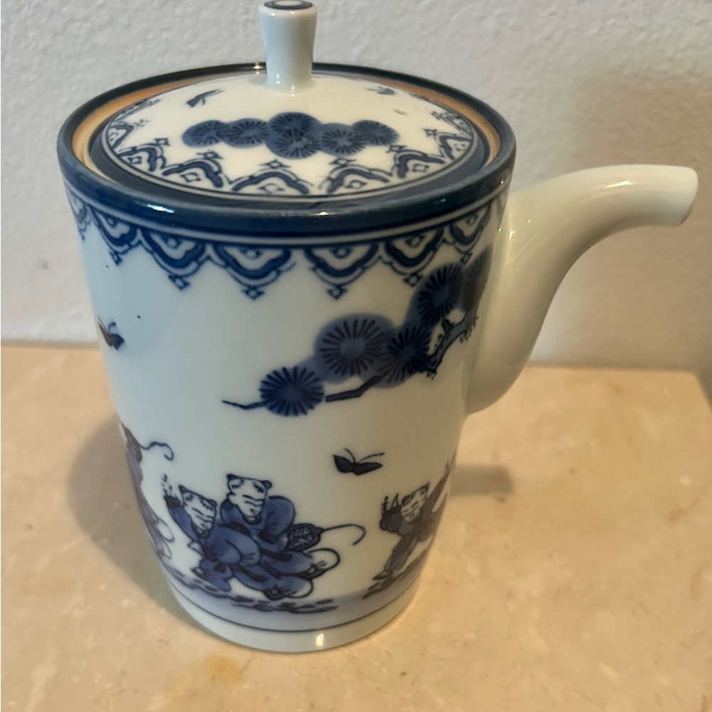 Antique Blue and white Japanese teapot (boys chasing butterflies).